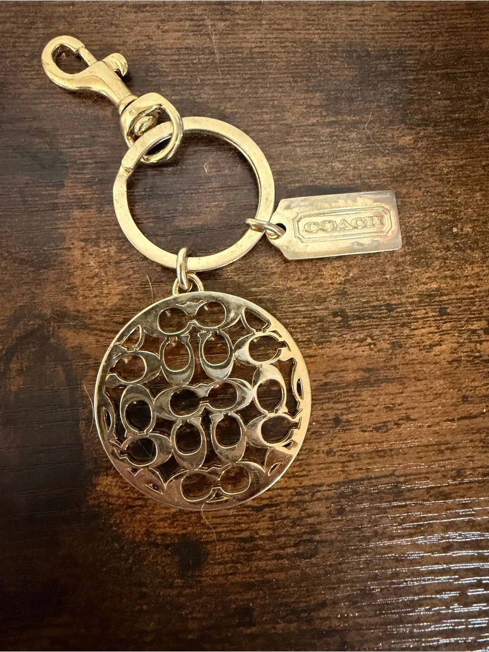 Coach gold tone